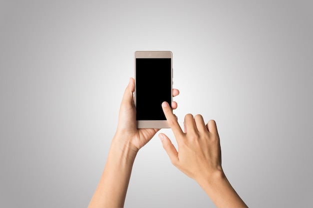 Mulher, mão, segurando, telefone, tela vazia, tela. Copie o espaço. Hand holding smartphone isolado no fundo branco.
