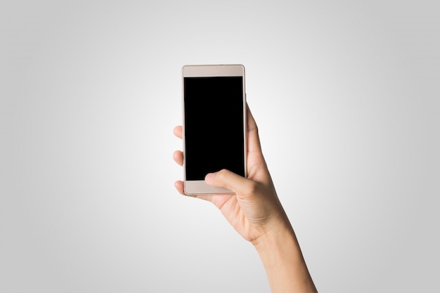 Mulher, mão, segurando, telefone, tela vazia, tela. Copie o espaço. Hand holding smartphone isolado no fundo branco.
