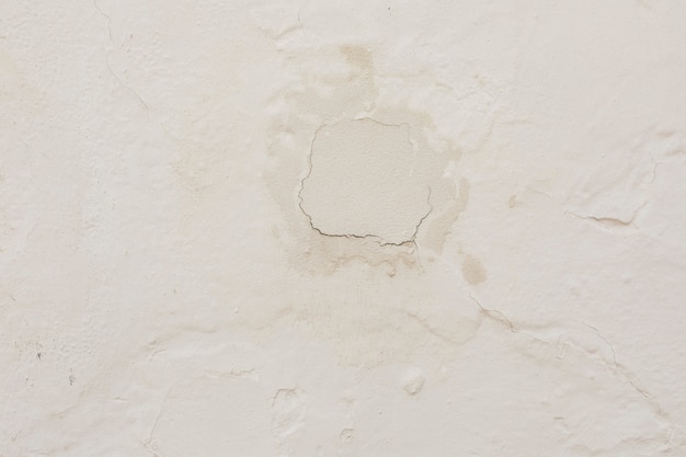 Muro de concreto com gesso e rachaduras