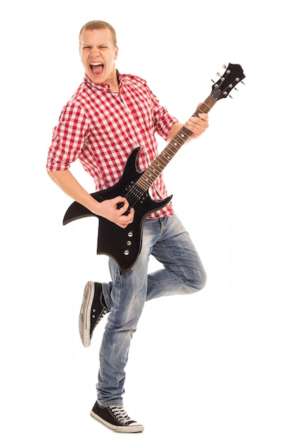 Foto grátis música. jovem músico com uma guitarra