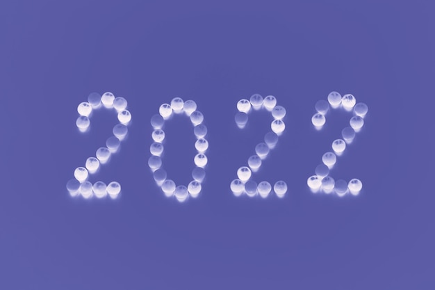 O ano de 2022 é apresentado a partir de doces redondos brancos sobre fundo de cor muito peri na moda. foto de alta qualidade