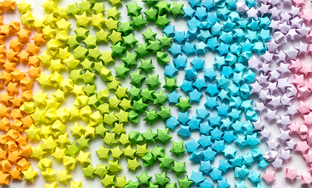 Foto grátis origami colorido estrelas de fundo