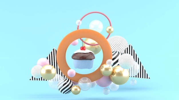 Os cupcakes estão no centro do círculo, entre as bolas coloridas no espaço azul