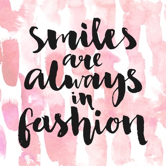 Os sorrisos estão sempre na moda citações inspiradoras para cartazes e cartões de caligrafia em rosa