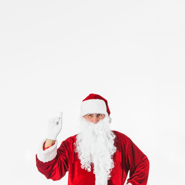 Foto grátis papai noel mostrando a mão com o dedo apontando