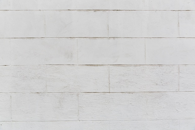 Foto grátis parede de tijolo branco com aparência grossa