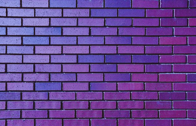 Parede de tijolo roxo bonito para o fundo