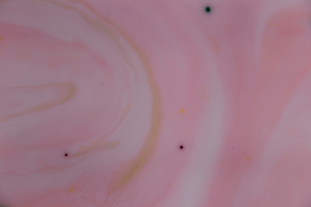 Foto grátis pasta de iogurte abstrata com pontos de tinta
