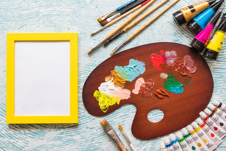 Foto grátis placa de visão superior ao lado do material de pintura