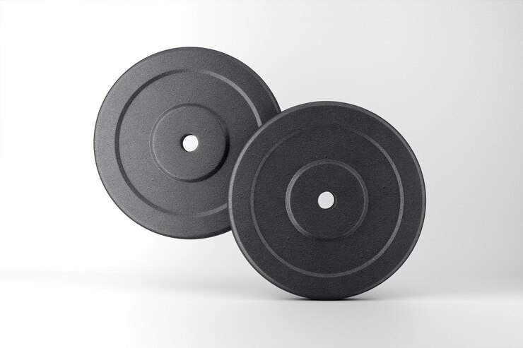 Foto grátis placas de pesos pretas para fitness e treinamento de força