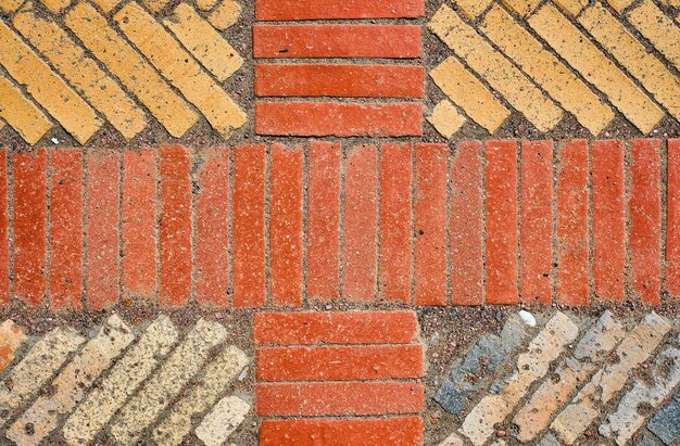 Plano de fundo da vista superior de paralelepípedos de cerâmica de tijolos antigos Faixas antigas dispostas em padrões geométricos A ideia de um papel de parede para uma mesa ou protetor de tela para publicidade com espaço para texto