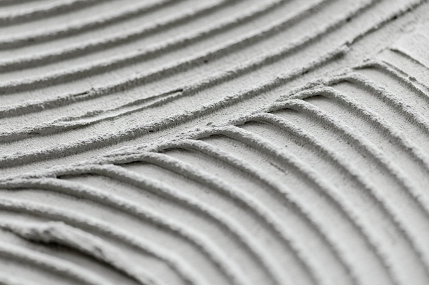 Plano de fundo texturizado de concreto com padrão ondulado cinza