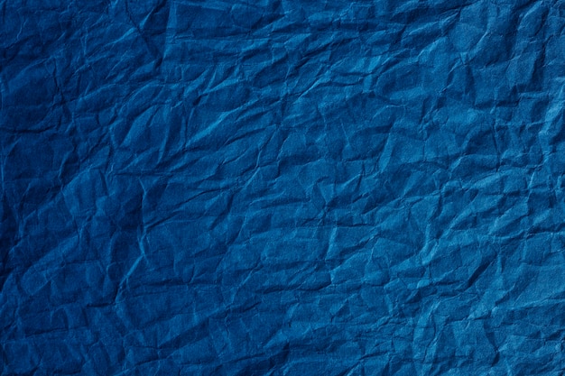 Plano de fundo texturizado de papel azul amassado