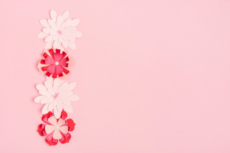 Foto grátis postura plana de flores de primavera de papel multicolorido com espaço de cópia