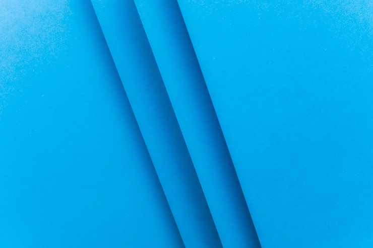 Foto grátis quadro completo de pano de fundo azul de papel