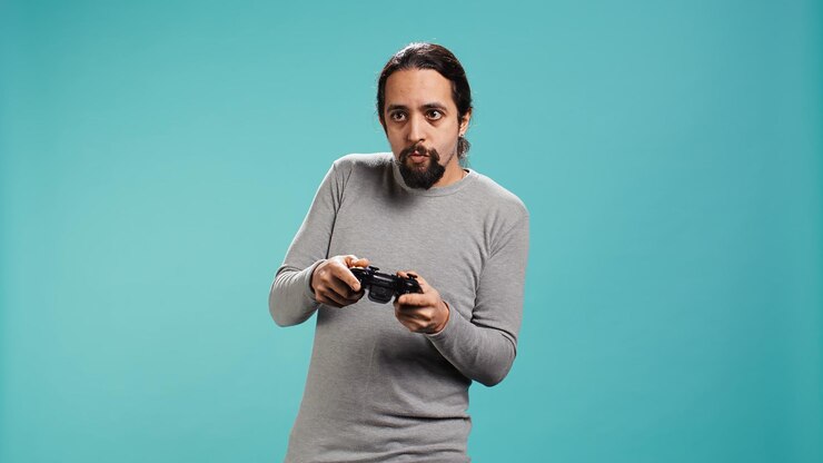 Foto grátis retrato de uma pessoa otimista jogando um jogo intenso de console de jogos