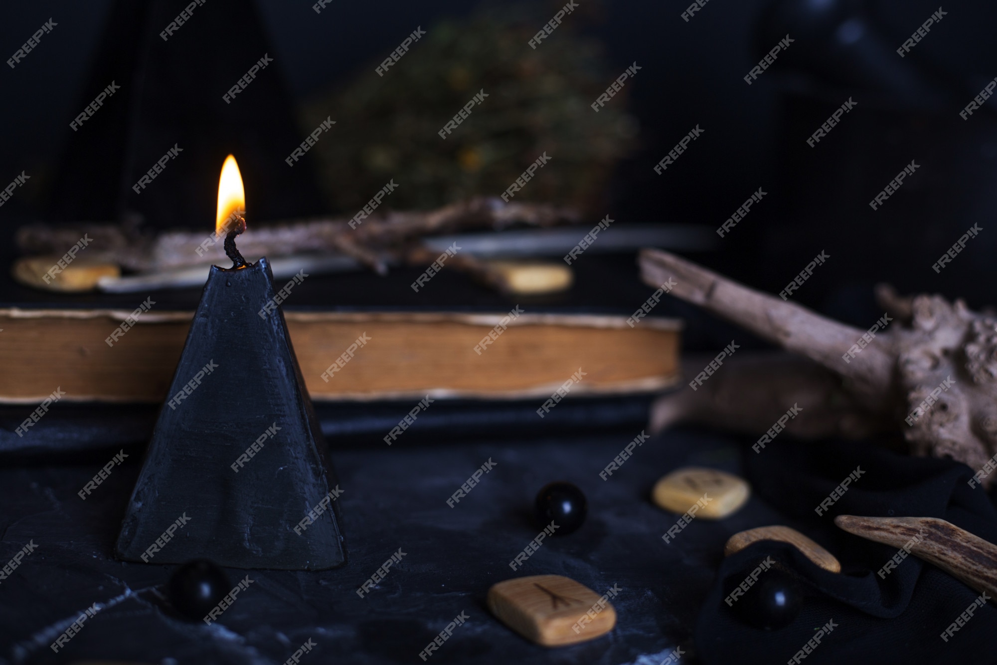 Black magic ritual with candles and runes | Premium Photo