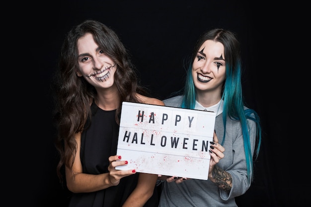 Sorrindo, meninas, segurando, signboard