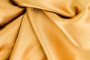 Foto grátis superfície de material dourado com ondas torcidas