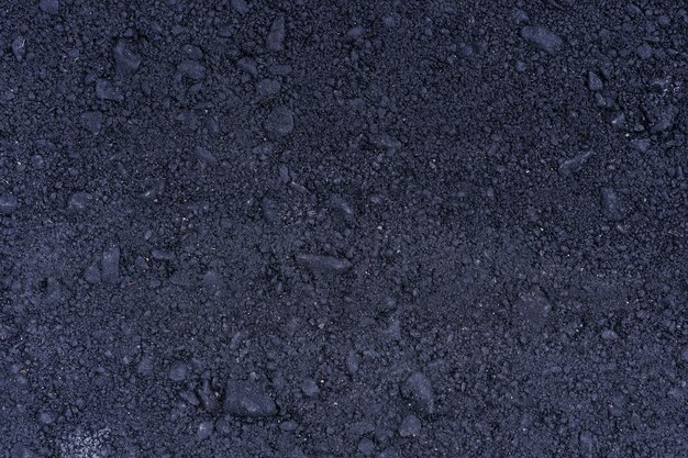 Superfície do grunge áspero de asfalto, estrada granulada cinza de asfalto, fundo de textura, vista superior
