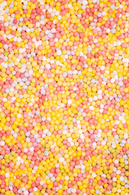 Tasty candy drops texture background