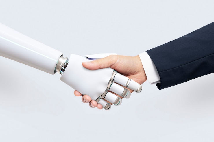 robô e ser humano de terno apertando a mão fechando acordo de como a IA pode beneficiar um negócio
