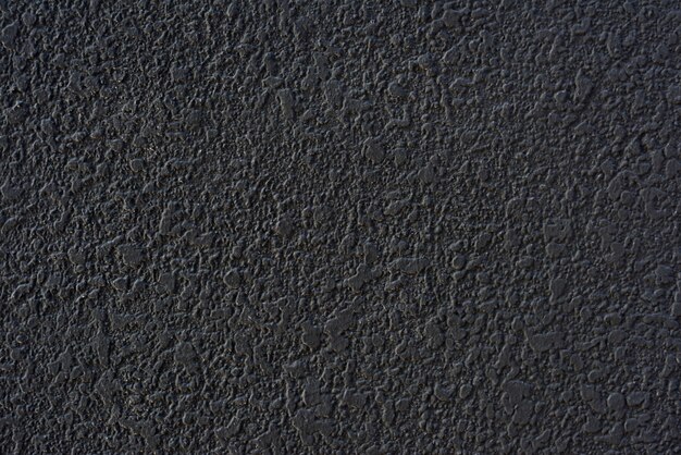 Textura áspera de parede com gesso de cimento preto