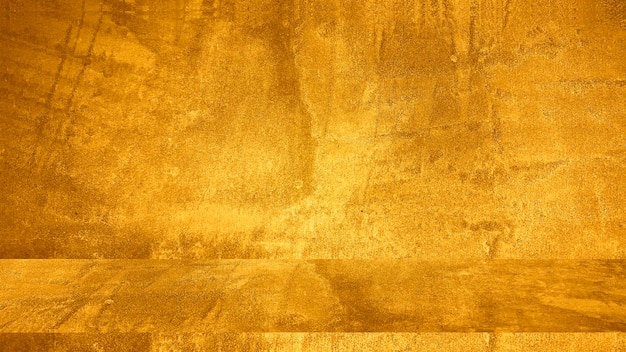 Textura de gesso decorativo dourado ou fundo grunge abstrato concreto para design