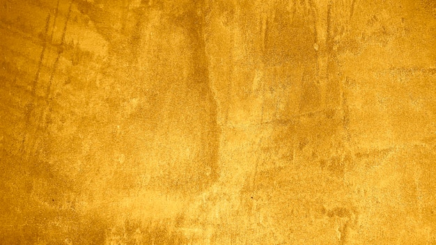 Textura de gesso decorativo dourado ou fundo grunge abstrato concreto para design