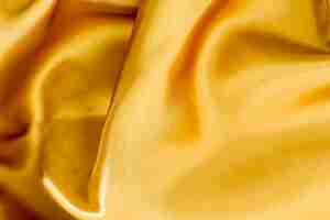 Foto grátis textura de material liso elegante tecido dourado
