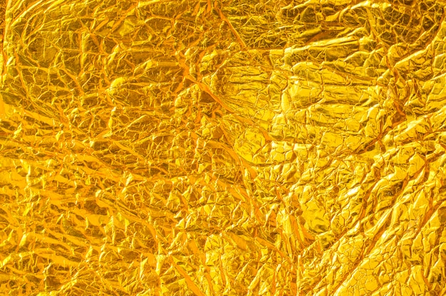 Textura de papel de alumínio com concreto dourado