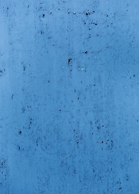 Textura de parede pintada azul com rachaduras