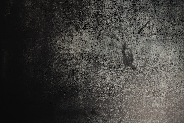 Textura de um quadro de giz em ardósia cinza escuro preto muito usado