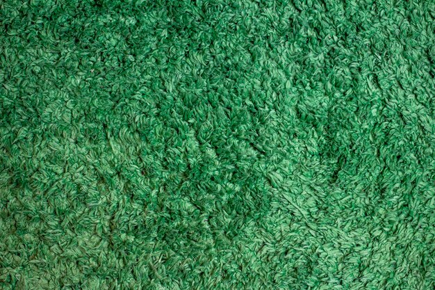 Textura fofa de tapete verde velho