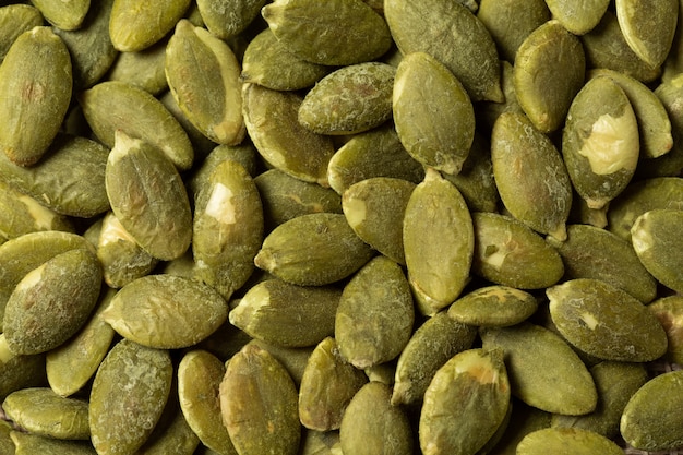 Textura verde macro das sementes de abóbora.