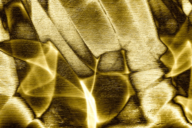 Foto grátis texturizado fundo dourado