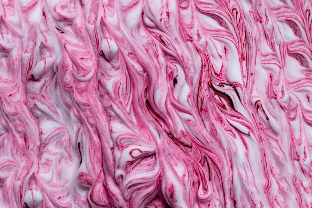 Tinta cor-de-rosa misturada em fundo branco de espuma