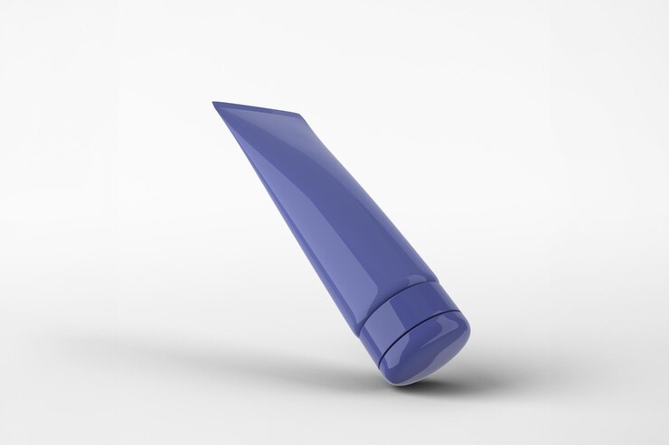 Foto grátis tubo cosmético azul com uma tampa contra um fundo branco