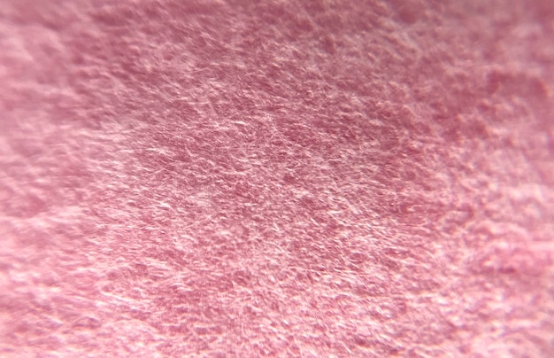 Um fundo de textura rosa com muitas texturas diferentes