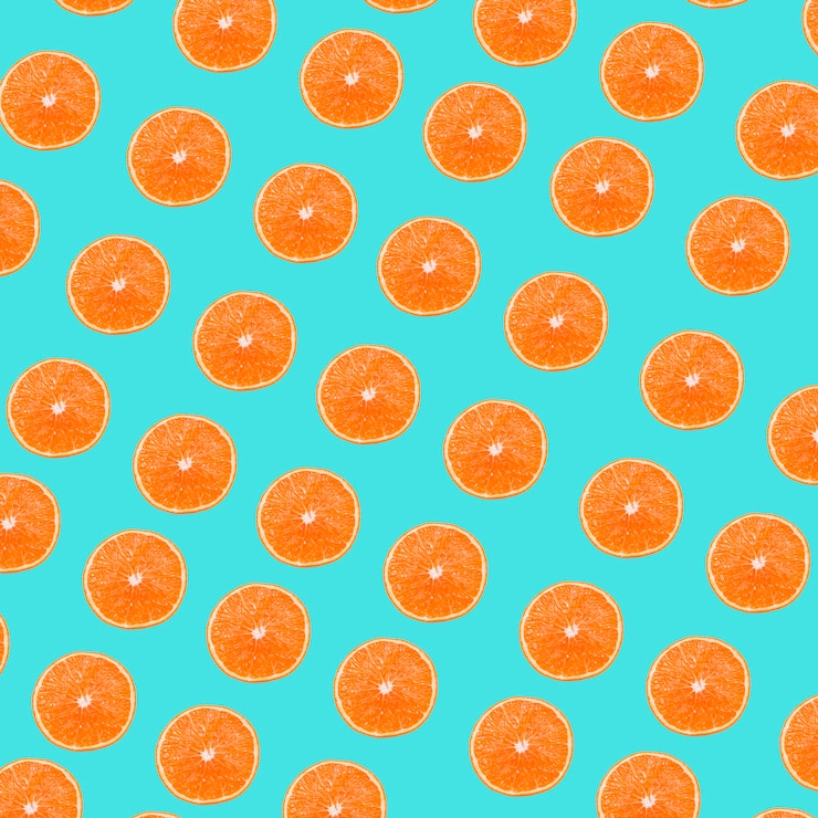 Foto grátis um padrão de fatias de laranjas no fundo turquesa