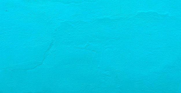 Foto grátis uma parede azul com uma superfície texturizada áspera.