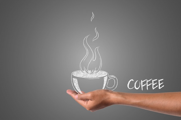 Uma xícara de café escrita com giz branco na mão, desenhar o conceito.