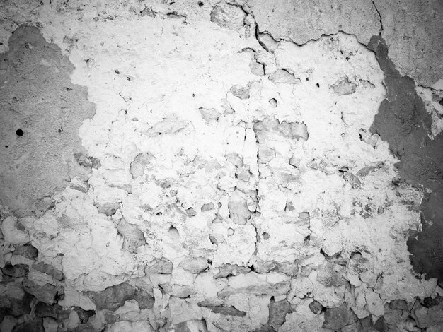 Velho fundo rústico rachado preto e branco velho muro de pedra vários tons de cinza