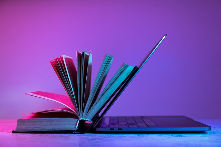 Foto grátis vida morta de livros versus tecnologia