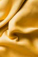Foto grátis vista superior conceito de textura de tecido dourado