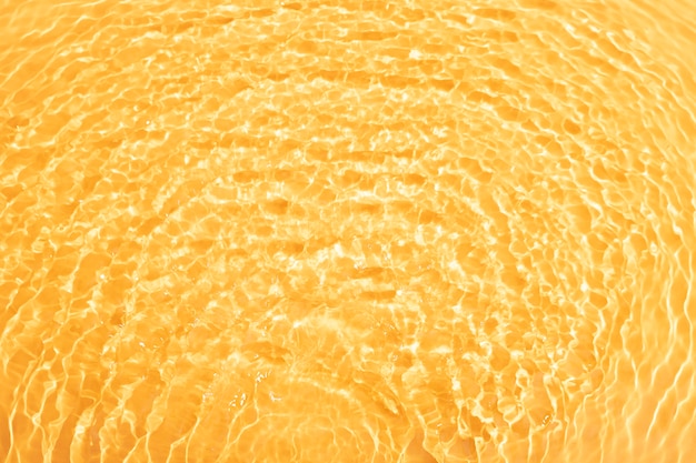 Vista superior da textura da água em laranja