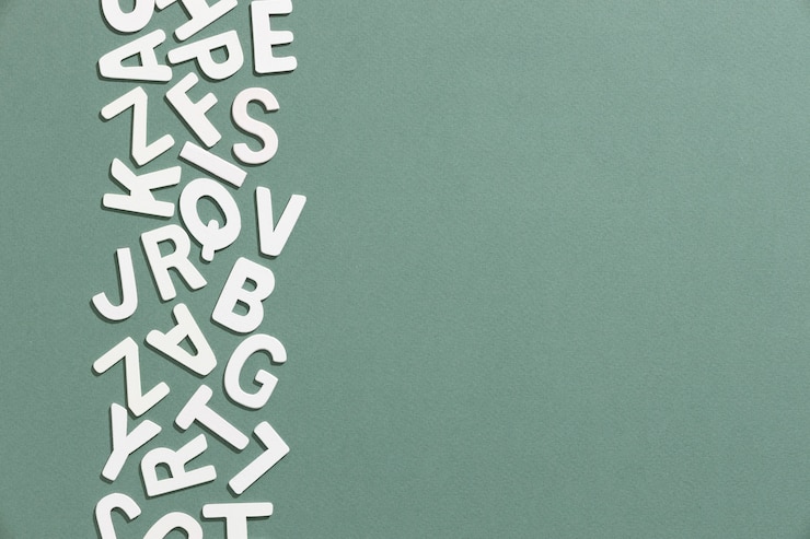 Foto grátis vista superior das letras do alfabeto com espaço de cópia para o dia da educação