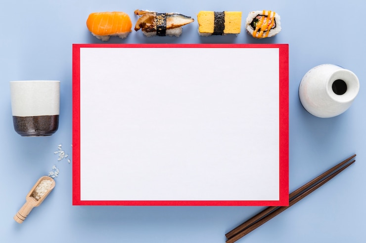 Foto grátis vista superior do sushi com menu em branco e pauzinhos
