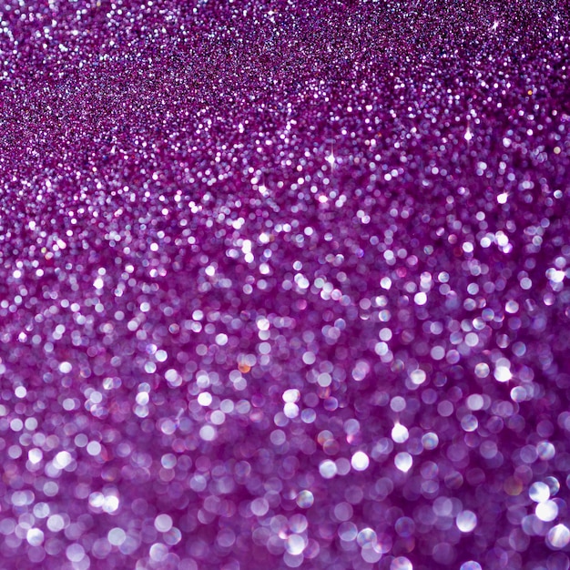 Foto grátis vista superior roxo glitter fundo close-up