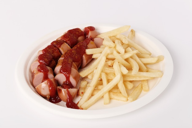 Foto grátis wurst de caril com molho e batatas fritas